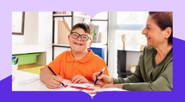 special education teacher and student working together in a classroom