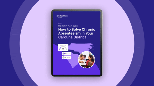 Tablet with an Ebook from SchoolStatus. Ebook is called How to Solve Chronic Absenteeism in Your District.