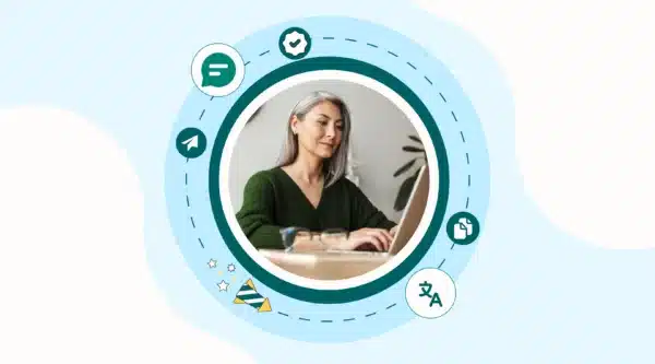 School leader sitting at laptop with icons for communication and engagement circling her.