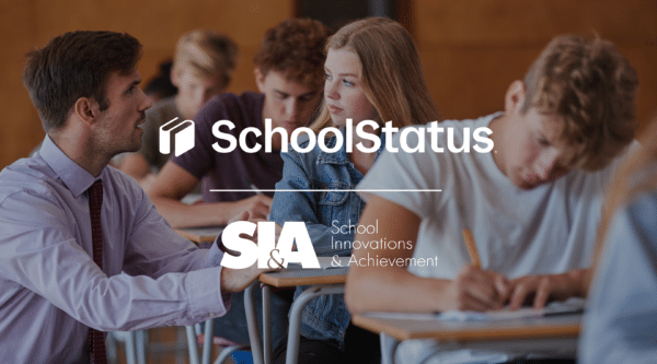SchoolStatus and SI&A logos over teacher and students in classroom