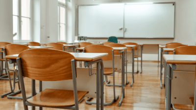 image of chairs and tables in empty classroom