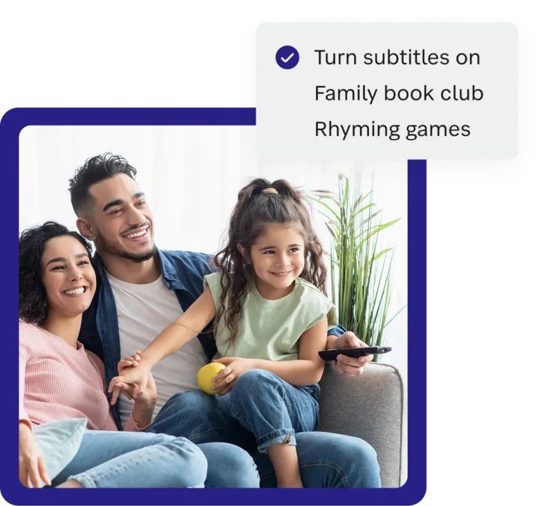 Family watching a movie with subtitles turned on to help with reading